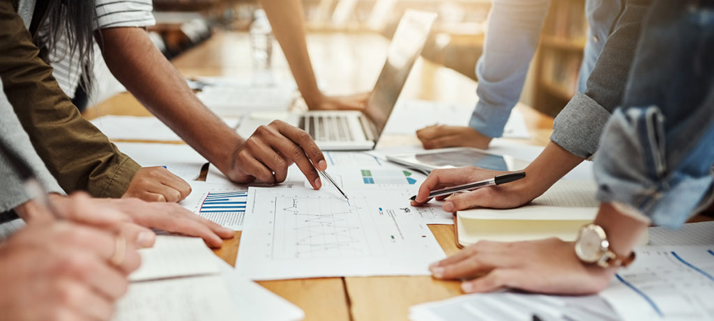 Business people, collaboration and paperwork with hands, statistics and social media trends. Office, writing and review of content creation team with SEO and target audience info for web update.